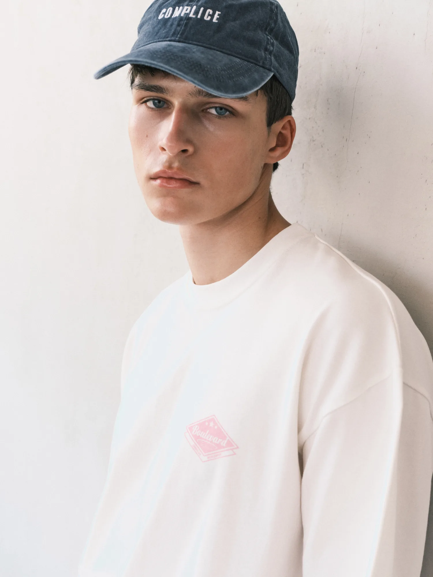 Complice portrait in a navy cap